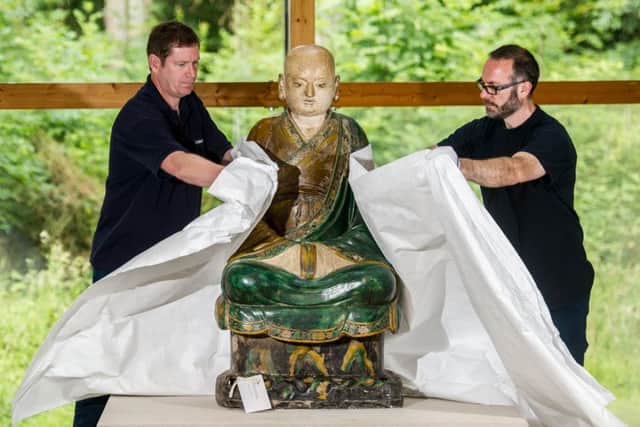 Technicians pack away the life-size Budhist Luohan as it leaves the Burrell as part of the museums refurbishment programme.
 Picture: John Devlin