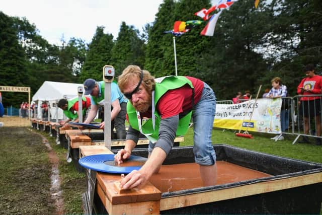Competitors take part in The World Gold Panning Championships. Picture: Getty