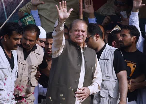 Deposed Pakistani Prime Minister Nawaz Sharif waves to his supporters. Picture: AP Photo/Anjum Naveed