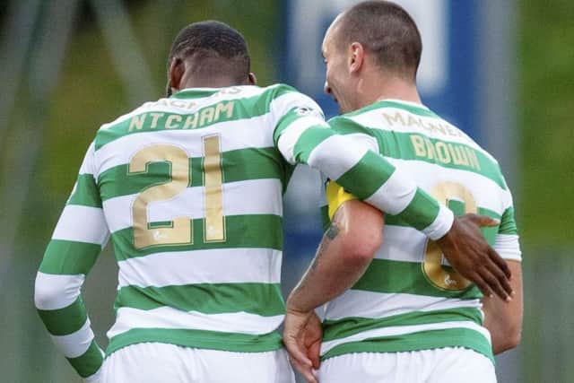 Celtic's Olivier Ntcham (left) and Scott Brown celebrate the opening goal. Picture: SNS