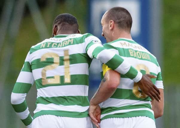 Celtic's Olivier Ntcham (left) and Scott Brown celebrate the opening goal. Picture: SNS