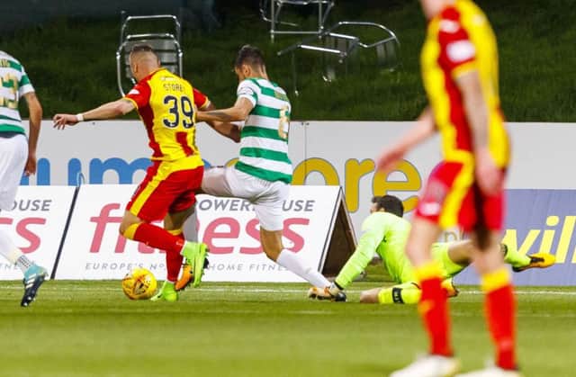 Miles Storey goes down under the challenge of Nir Bitton. Picture: SNS