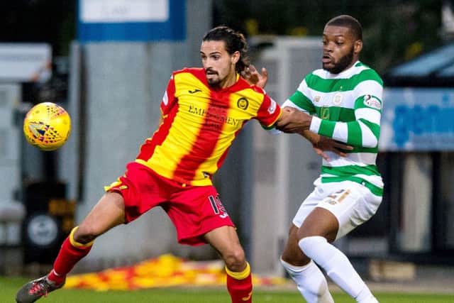 Ryan Edwards and Olivier Ntcham fight for possession. Picture: SNS