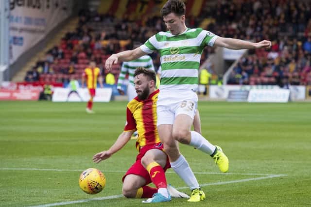 Kieran Tierney rides a challenge by Steven Lawless. Picture: SNS