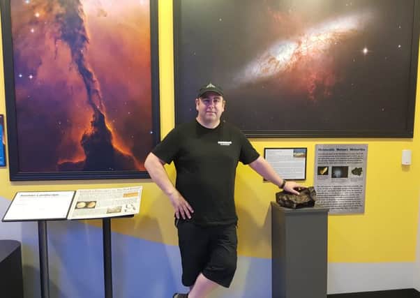 Steven Gray, pictured at the Peoria Riverfront Museum, Illinois, is in the US to film 360 degree footage of a total solar eclipse.