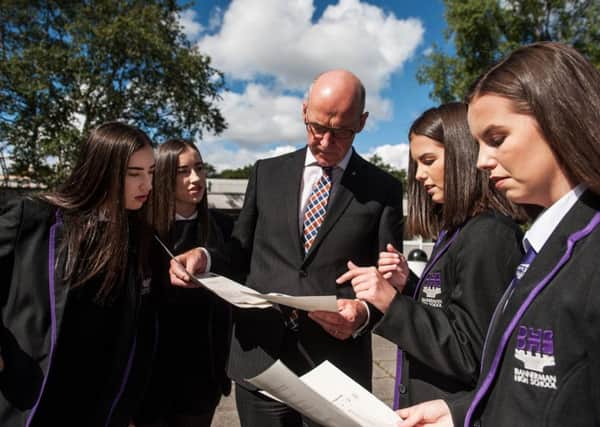 John Swinney with pupils from Bannerman High School, Baillieston, as they received their exam results last Tuesday. Picture: John Devlin