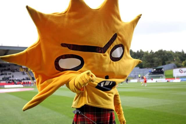 Partick Thistle mascot Kingsley mooned the Celtic huddle. Picture: Jane Barlow/PA Wire