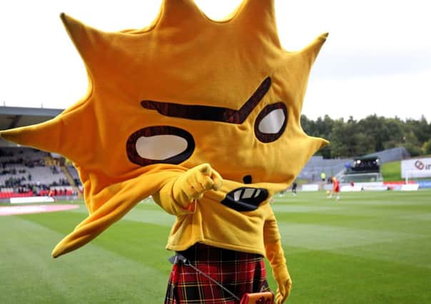 Partick Thistle mascot Kingsley mooned the Celtic huddle. Picture: Jane Barlow/PA Wire