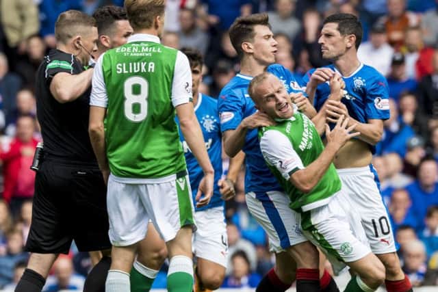 Rangers' Ryan Jack grabs Hibs' Dylan McGeouch, in part of an incident which led to his red card. Picture: SNS/Alan Harvey