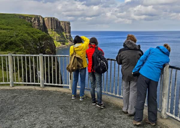 Tourists on the view point of the Kilt Rock Basaltic cliffs at Staffin on Skye. Picture: GUENTER FISCHER/BROKER/REX/SHUTTERSTOCK