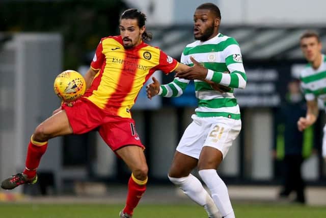 Olivier Ntcham challenges Particks Ryan Edward during Celtics 1-0 win at Firhill on Friday. Picture: PA.