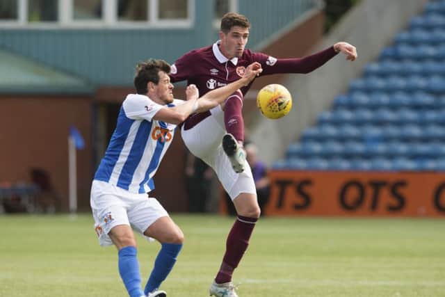 Kilmarnocks Gordon Greer  challenges Kyle Lafferty of Hearts at Rugby Park on Saturday. Picture: SNS.