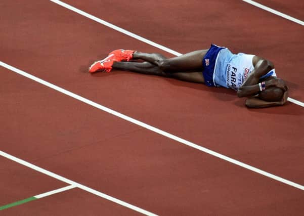 Sir Mo Farah lies anguished after finishing second in the 5,000m. Picture: Getty.