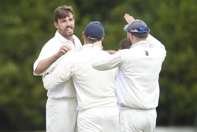 Grange bowler James Tapper, left, celebrates after claiming the wicket of Arbroath opener Brendon Ford. Picture: Greg Macvean.