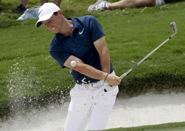 Rory McIlroy hits his shot from the bunker on the 15th hole during the final round of the US PGA Championship. Picture: AP.