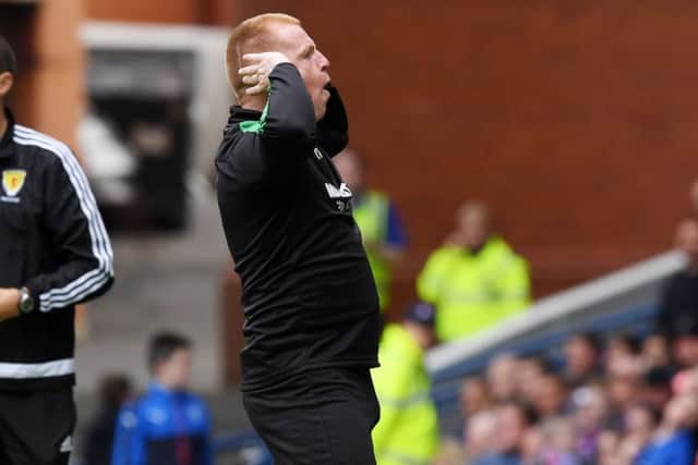 Lennon cups his ears as he celebrates Murray's equaliser. Picture: SNS Group