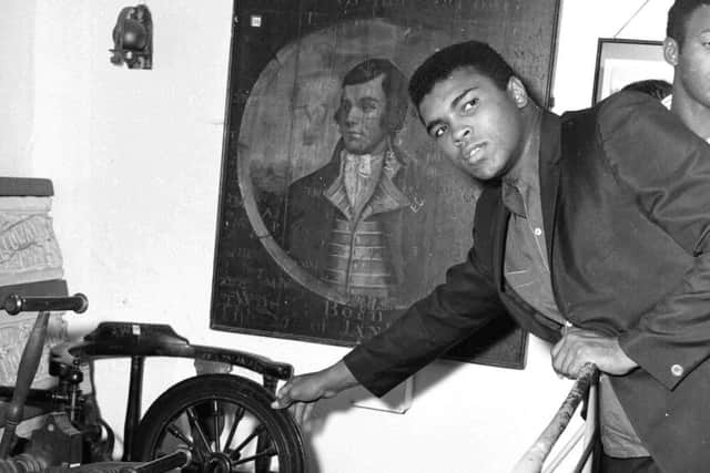 Muhammad Ali pictured at the Robert Burns cottage in Alloway in 1965. Picture: TSPL