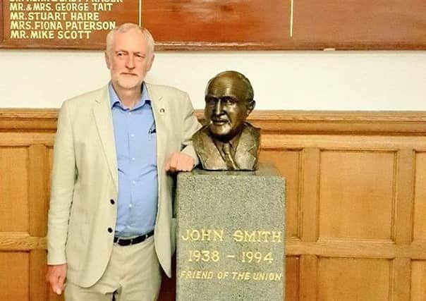 Jeremy Corbyn with the bust of John Smith at Glasgow University Union
