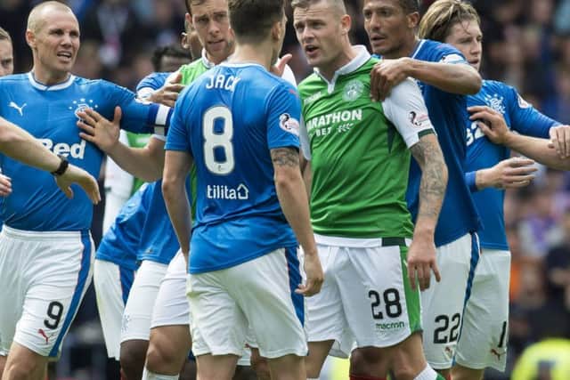 Ryan Jack clashes with Hibs' Anthony Stokes amid a melee which leads to Jack being shown a red card. Picture: SNS