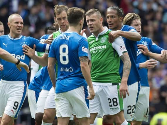Ryan Jack clashes with Hibs' Anthony Stokes amid a melee which leads to Jack being shown a red card. Picture: SNS