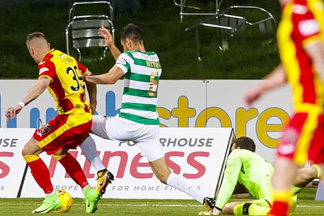 Nir Bitton clashes with Miles Storey in the penalty box. Picture: SNS