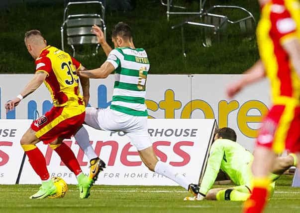 Nir Bitton clashes with Miles Storey in the penalty box. Picture: SNS