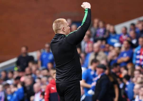Hibs manager Neil Lennon gestures at the Rangers supporters after his side equalised at Ibrox. Picture: SNS.