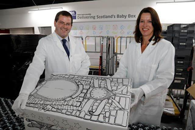 Minister Mark McDonald with the baby box