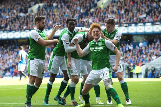 Hibs' players celebrate Vykintas Slivka's goal on their way to winning 3-2 against Rangers at Ibrox. Picture: SNS/Alan Harvey
