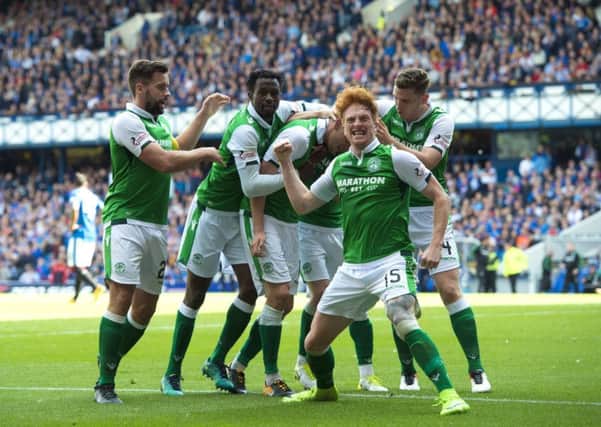 Hibs' players celebrate Vykintas Slivka's goal on their way to winning 3-2 against Rangers at Ibrox. Picture: SNS/Alan Harvey