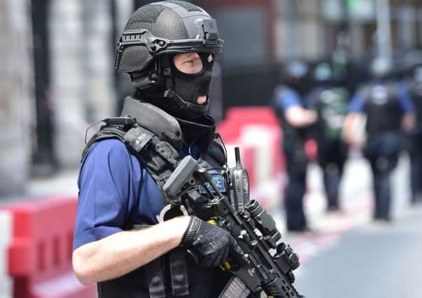An armed policeman on patrol in London.