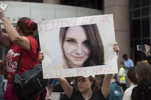 Protesters in Minneapolis carry an image of Heather Heyer during a demonstration against racism and the violence in Charlottesville. Picture: Getty Images