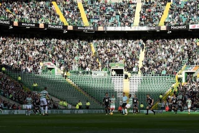 The space normally occupied by the Green Brigade sits empty at Celtic Park during the match against Rosenborg. Picture: SNS