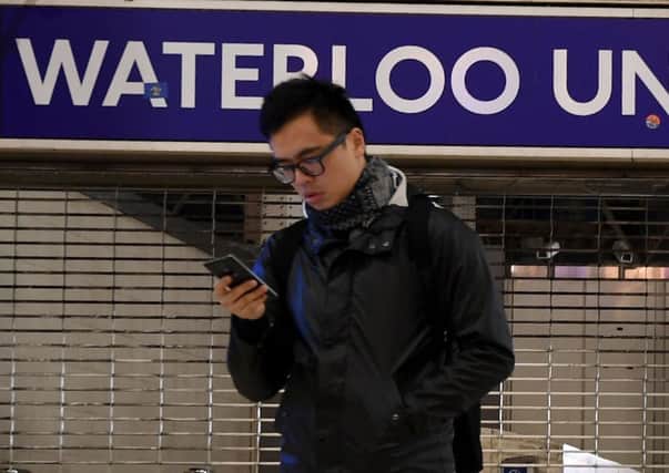 Jim Duffy found that while people refuse to talk to each other on the London Underground, they are all happy to communicate feverishly on social media. Picture:  AFP / Ben Stansall