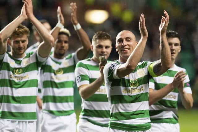 Celtic's Scott Brown, right, leads the celebrations at full-time. Picture: SNS