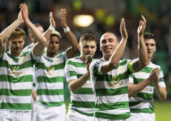 Celtic's Scott Brown, right, leads the celebrations at full-time. Picture: SNS