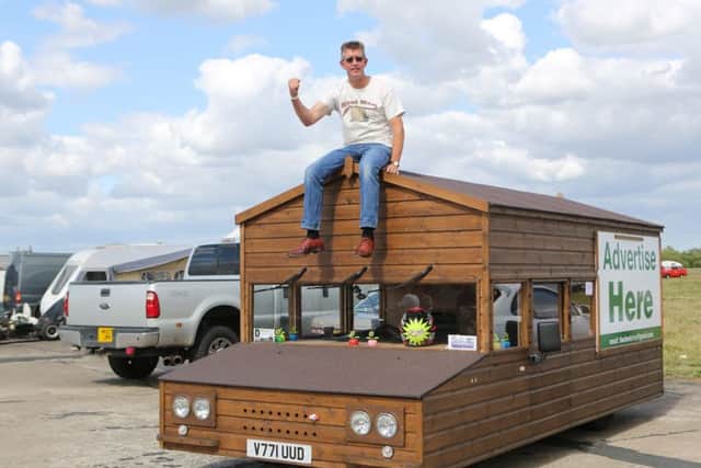 Kevin Nicks, a 52-year-old mechanic and gardener, transformed his Volkswagen Passat into the shed. Picture: SWNS