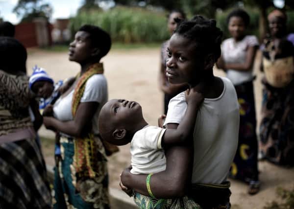 Women with their babies in Lilongwe, Malawi, where many Scots have worked as volunteers. Picture: Getty Images