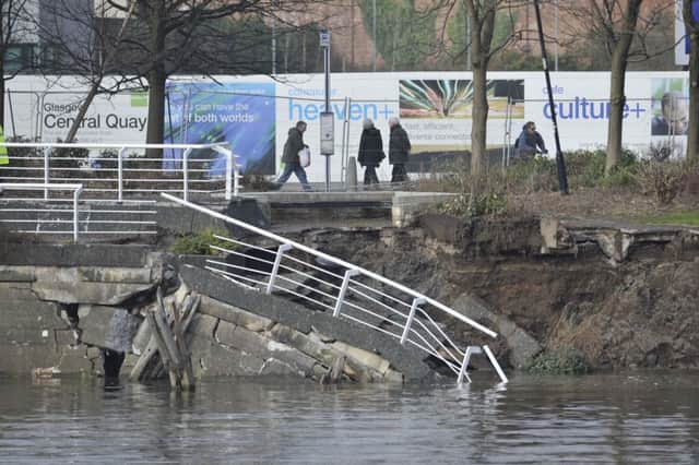 A section of the Clyde Walkway collapsed at Anderston Quay in February 2013. Glasgow councillors now plan to spend 50 million to secure other quay walls along the river. Picture: Robert Perry/TSPL
