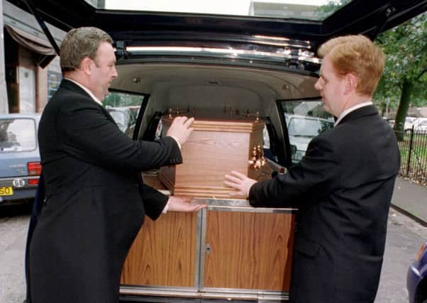 BARCLAY'S FUNERAL SERVICES. - 24/9/98 - (L)TO(R) Peter Deery (FUNERAL DIRECTOR) and Steven Herriot (CHAUFFEUR BEARER) load coffin outside Barclay's Funeral Services
