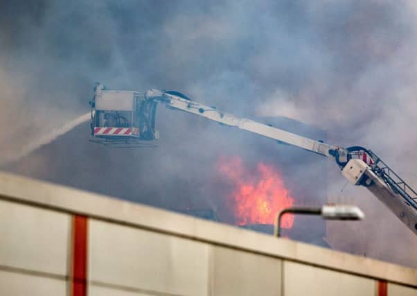 Firefighters attend the scene of a blaze at Blochairn Fruitmarket. Picture: Robert Perry/Getty Images