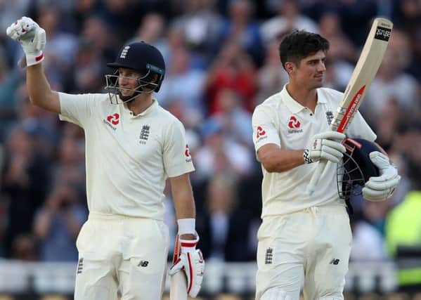 England's Alastair Cook, right, celebrates his ton with fellow centurion Joe Root during the first day of the First Investec Test at Edgbaston. Picture: Nick Potts/PA