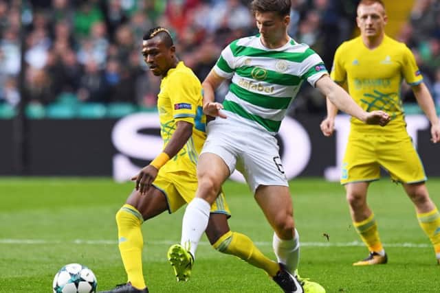 Kieran Tierney, right, competes with Astana's Patrick Twumasi