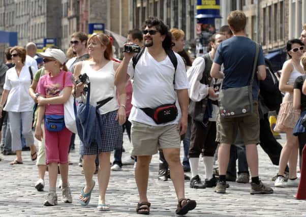 Festival-goers and tourists on the High Street. Picture: TSPL