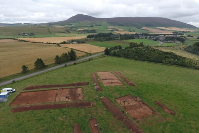 A drone shot of the earlier excavation of the Rhynie site with Tap o' North hillfort in the background to be the focus of fresh investigation. PIC: Aberdeen University.