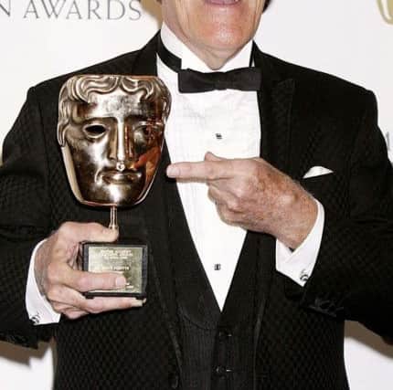 Bruce Forsyth with the Bafta Fellowship award during the British Academy Television Awards. Picture: Yui Mok/PA Wireholder.