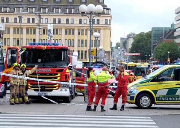 A photo taken from the instagram account of BernatMajo shows police officers and rescuers standing in a street  in the Finnish city of Turku where several people were stabbed. 
Picture: Getty