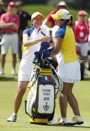 Catriona Matthew, left, of Scotland, celebrates with teammate Karine Icher, of France, after winning their foursome match against the United States. Picture: Charlie Neibergall/AP
