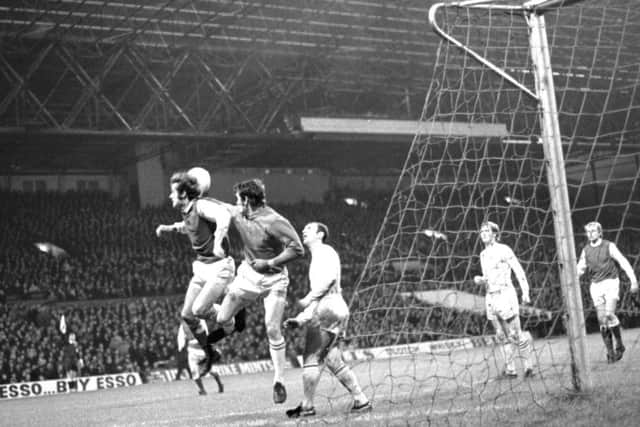 In 1972 Celtic goalkeeper Evan Williams dives to keep the ball from Pat Stanton of Hibs at Parkhead