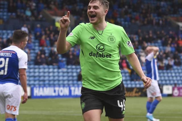 Celtic's James Forrest celebrates his opening goal. Picture: SNS/Craig Williamson